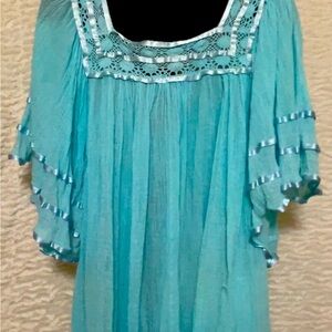 Puebla Mexican turquoise Blouse with ribbon trim.
